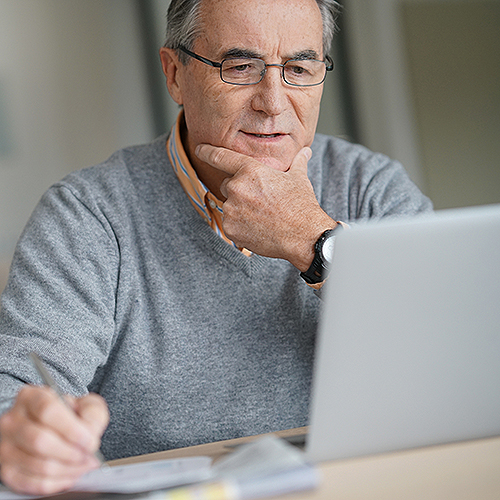 Big Bend patient looking at the Big Bend patient portal on his laptop.